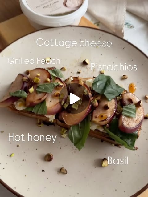 Toast with Cotti, grilled peach, pistachios, basil and hot honey